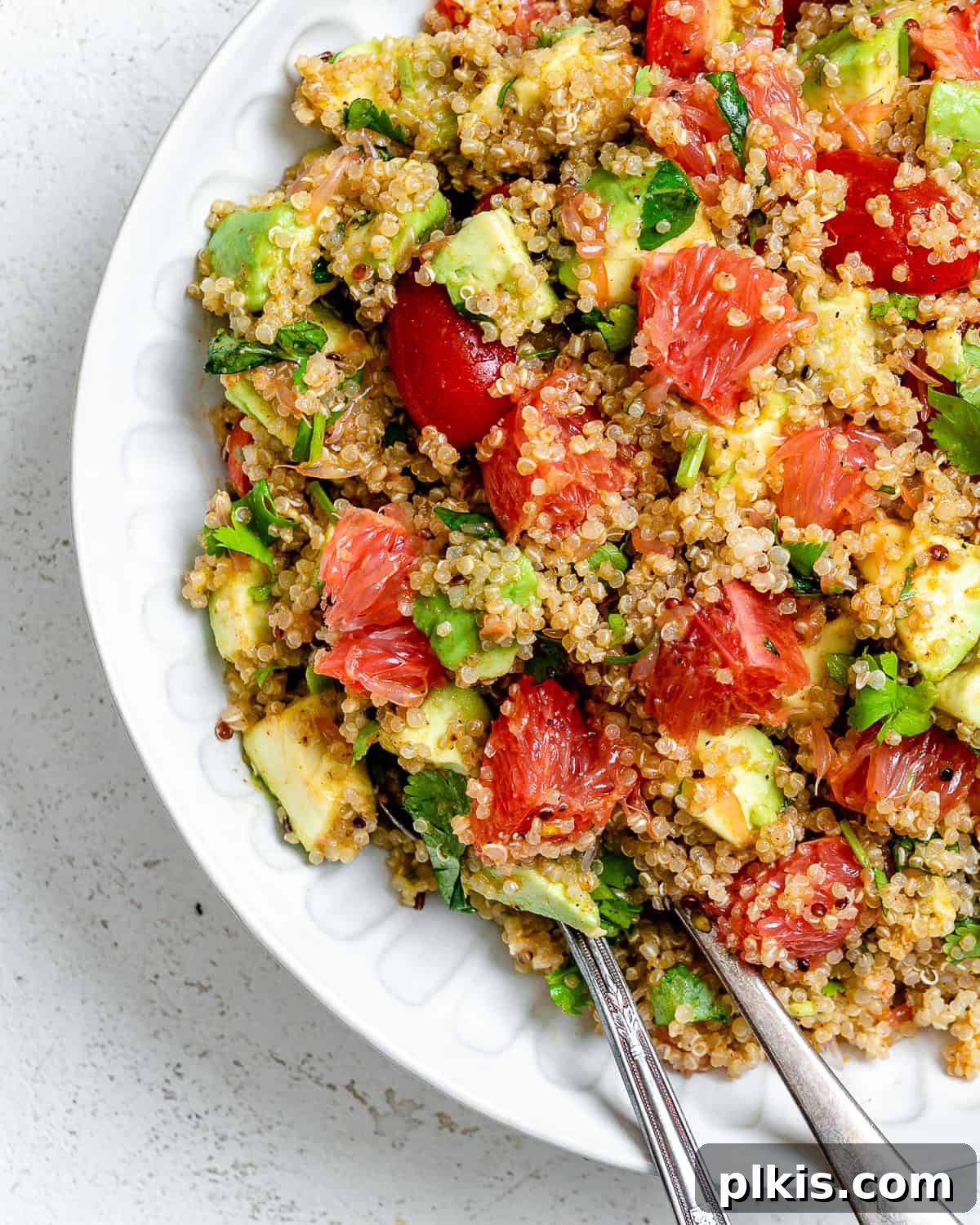 A final shot of the completed Avocado Quinoa Salad with Grapefruit, emphasizing its inviting and healthy appeal.