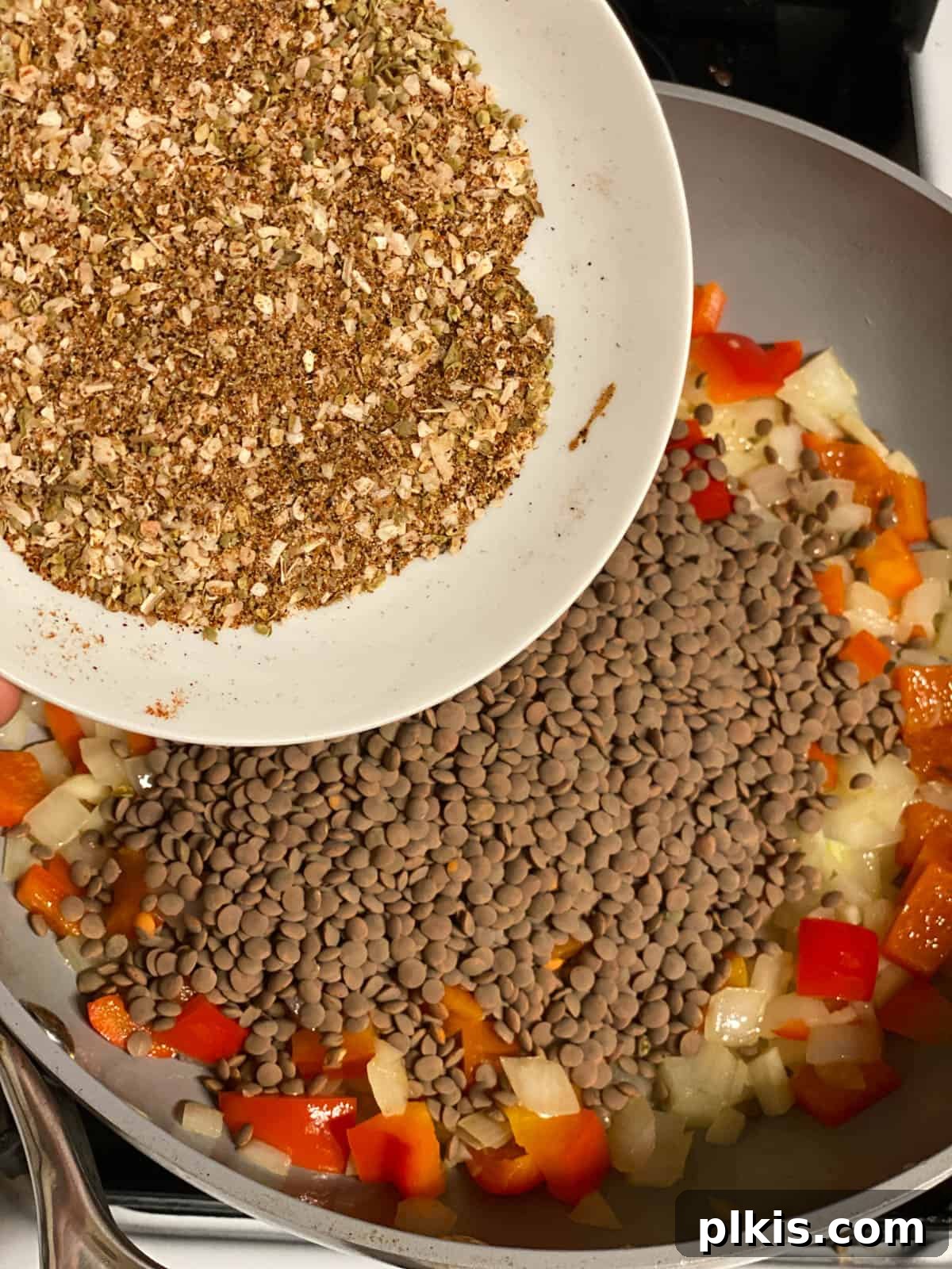 Plant-Powered Lentil Tacos 6 Third step of making lentil tacos: Lentils and the spice blend are added to the sautéed vegetables.