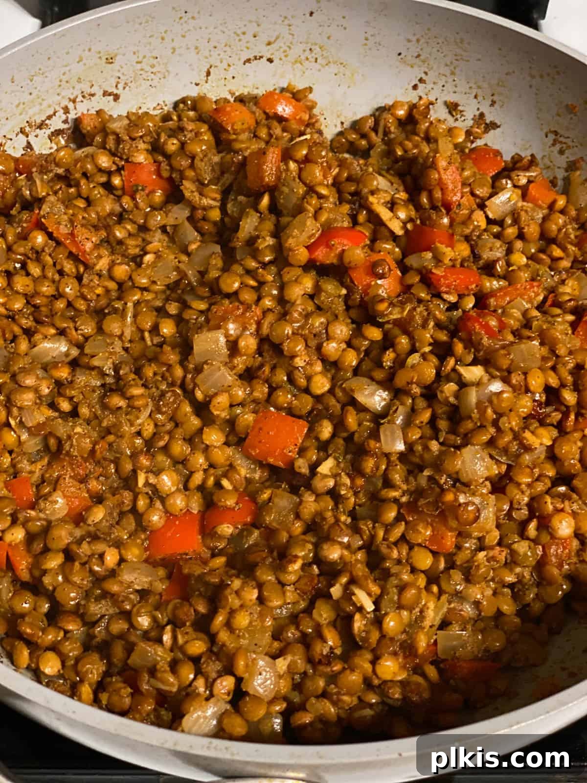 Plant-Powered Lentil Tacos 7 Fourth step of making lentil tacos: Vegetable broth is added to the lentils and spices, then brought to a boil.