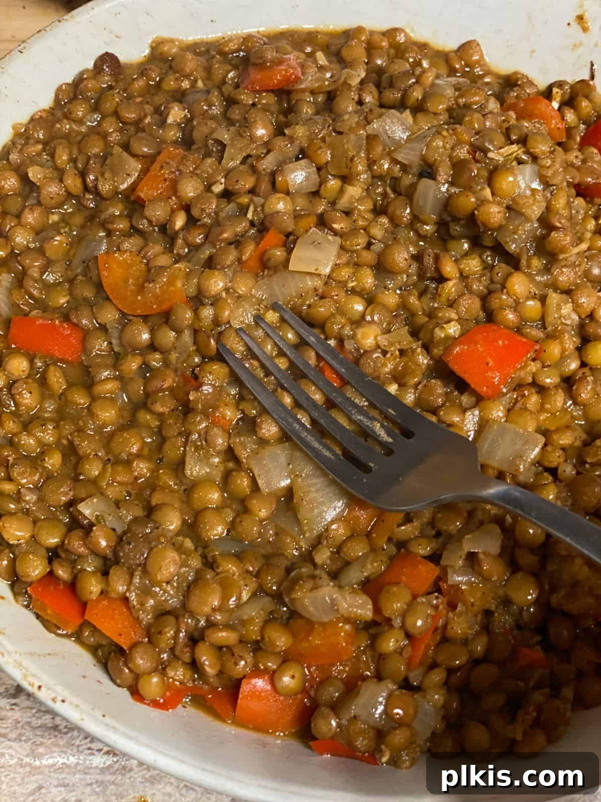 Plant-Powered Lentil Tacos 8 Fifth step of making lentil tacos: The cooked lentil mixture is mashed to achieve a desired consistency, ready for assembly.