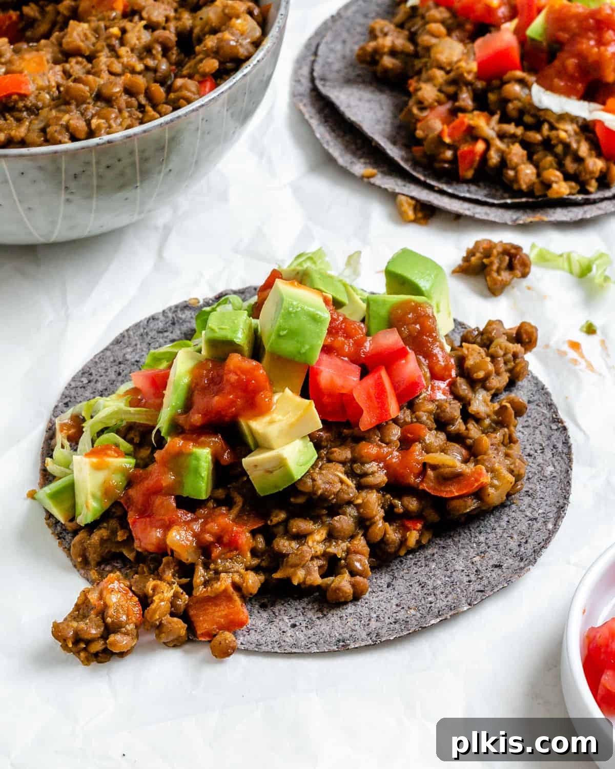 Plant-Powered Lentil Tacos 9 A close-up of a beautifully assembled Lentil Taco, showcasing the rich lentil filling and fresh toppings on a tortilla, ready to be enjoyed.