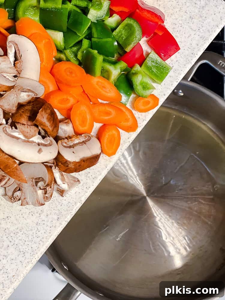Spicy Kung Pao Vegetable Stir-fry 4 Process shot showing adding veggies to pan.