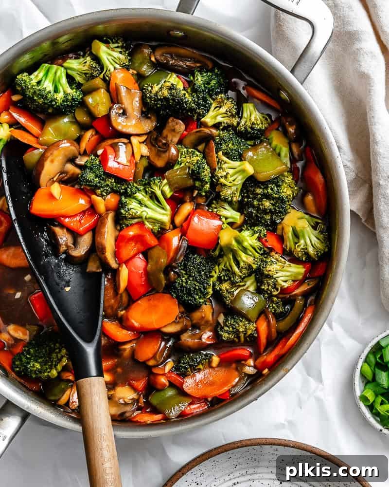 Spicy Kung Pao Vegetable Stir-fry 7 Process shot showing stirring ingredients in the pan.