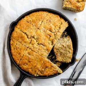 Golden Crust Vegan Cornbread in a Cast Iron Skillet 15 completed Vegan Cornbread Recipe in a Cast Iron Skillet against a white background