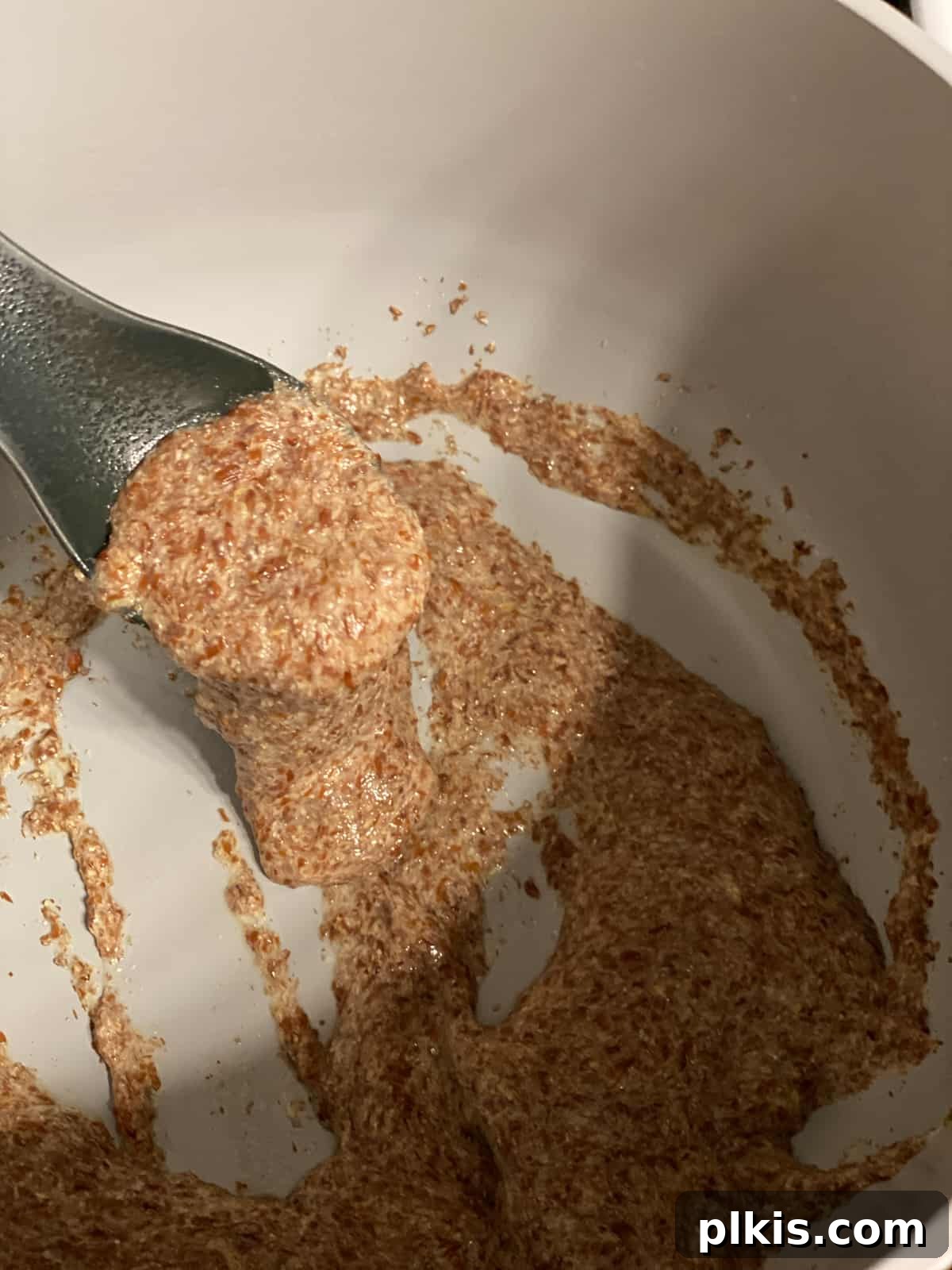 Golden Crust Vegan Cornbread in a Cast Iron Skillet 6 process shot of mixing flaxseed and water mixture in pan until gummy
