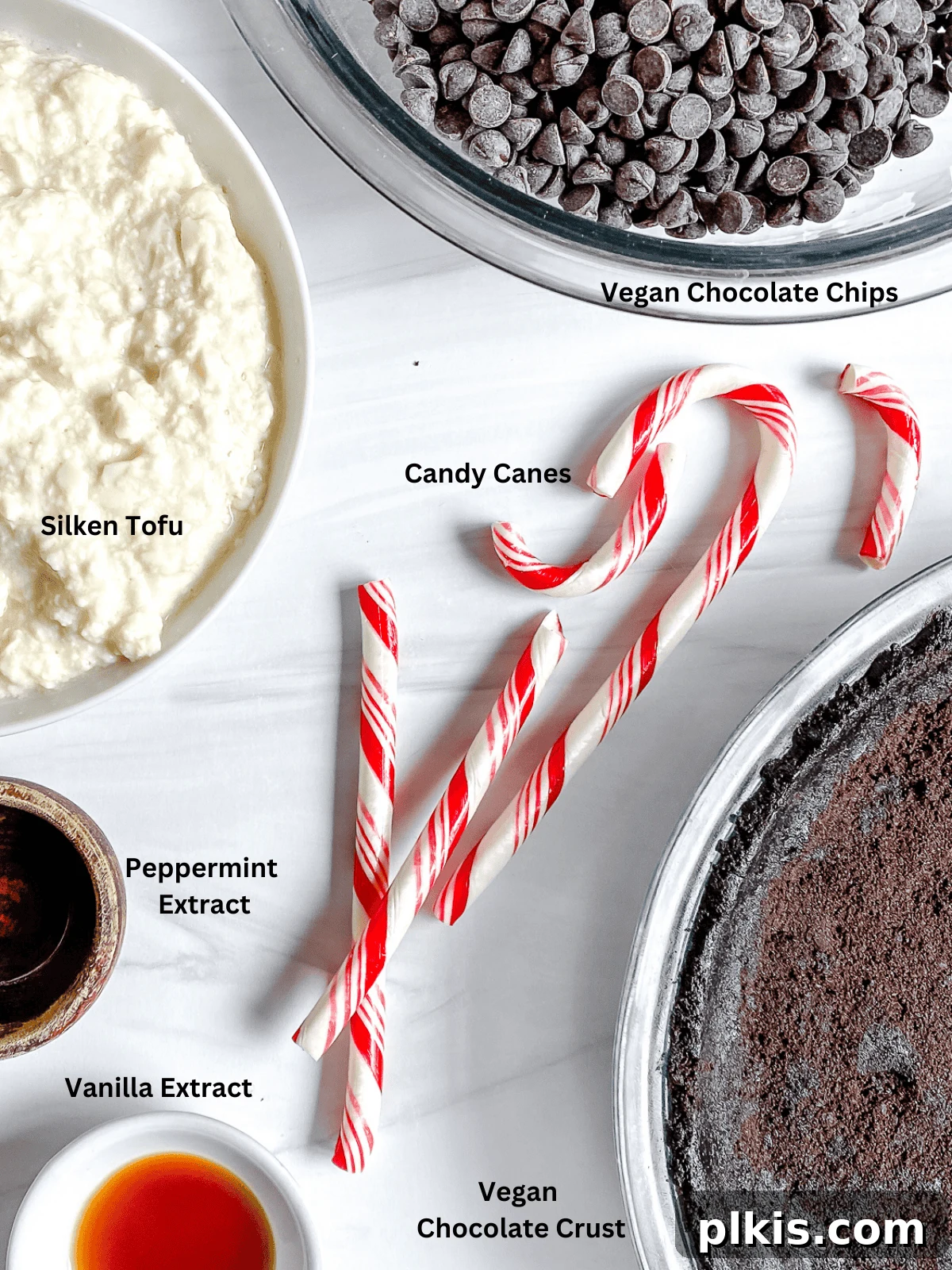 Decadent Vegan Peppermint Chocolate Pie 3 All the measured ingredients for Silken Chocolate Peppermint Pie are neatly arranged on a pristine white surface, ready for assembly.