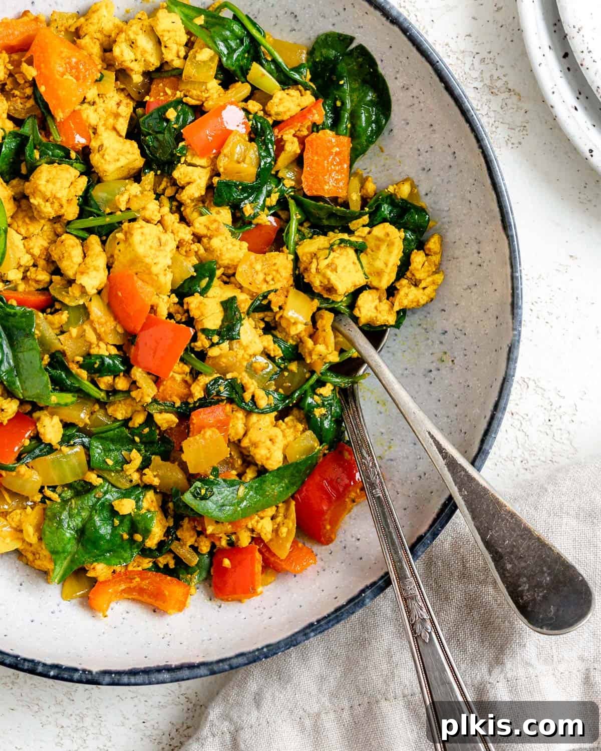 Fluffy and Flavorful Vegan Tofu Scramble with Garden Veggies 10 A beautifully plated serving of the best vegan tofu scramble with mixed vegetables, ready to be enjoyed.