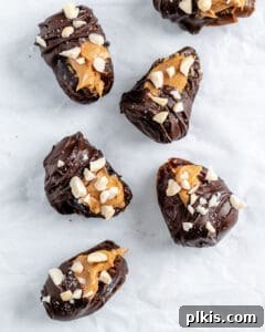 Peanut Butter Date Delights 11 the final step of adding nut toppings to chocolate-covered stuffed dates