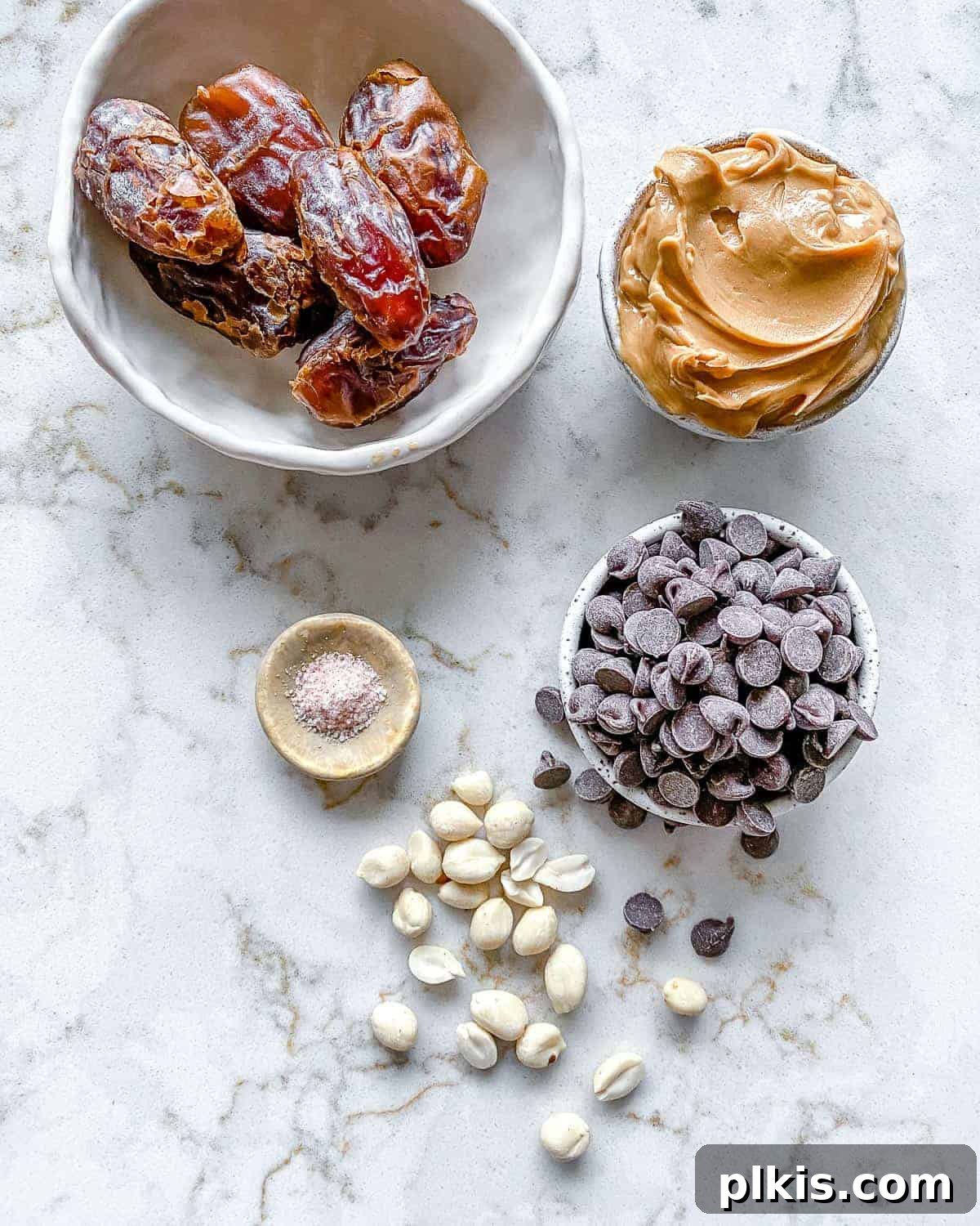 Peanut Butter Date Delights 4 measured out ingredients for stuffed dates arranged neatly on a white surface