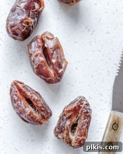 pitted Medjool dates arranged on a clean white surface