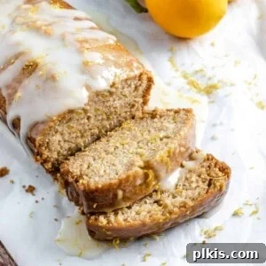 Bright & Tangy Vegan Lemon Loaf 10 completed sliced lemon loaf against a white background