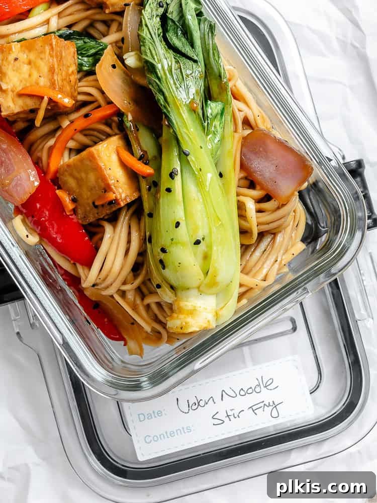Completed Vegetable Yaki Udon Noodles [Stir-Fry] in a glass storage container for meal prep.