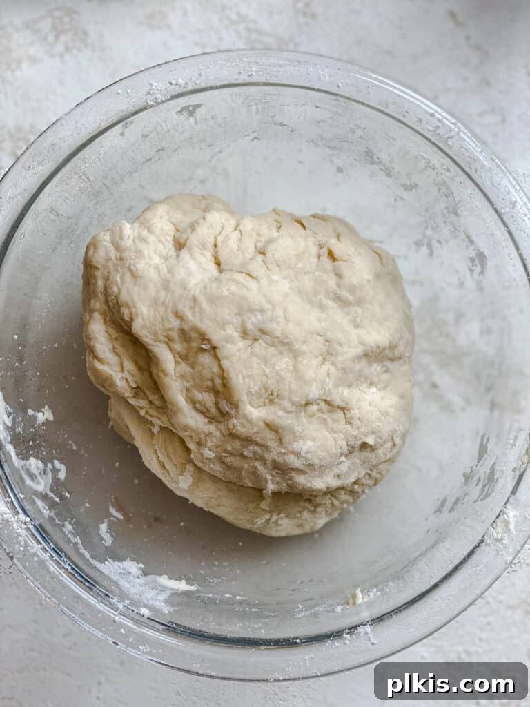Handcrafted Flour Tortillas 8 A smooth ball of tortilla dough resting in a glass bowl.