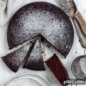 35 Irresistible Vegan Cake Creations 11 A delicious and easy chocolate depression cake, also known as wacky cake, sliced and ready to enjoy on a white surface.