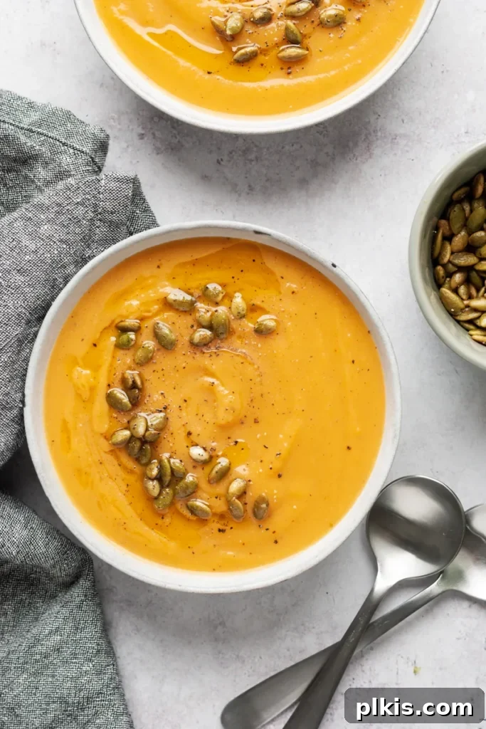 Over 30 Quick and Flavorful Vegan Instant Pot Recipes 12 completed pumpkin soup in two white bowls against a whiet surface