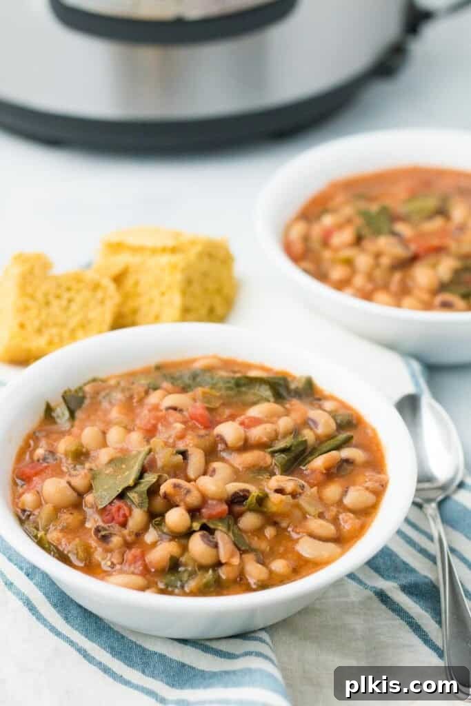 Over 30 Quick and Flavorful Vegan Instant Pot Recipes 34 completed black eyed peas in a white bowl with a bowl in the background against a white surface with a towel