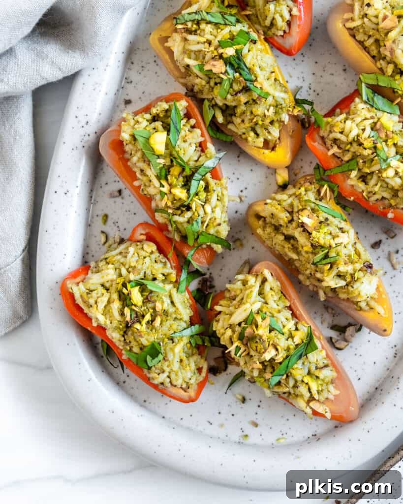 50 Quick Vegan Bites 54 Finished Stuffed Roasted Sweet Peppers beautifully plated on a white tray.