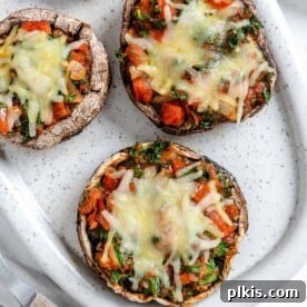completed Portobello Mushroom Pizzas in a white serving tray