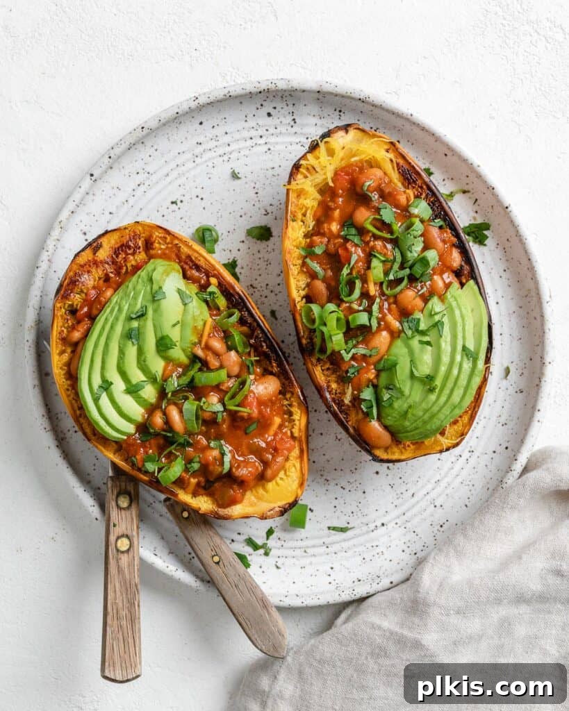 Golden Spaghetti Squash Bowls with Spicy Chili Cheese 11 A perfectly prepared chili cheese stuffed spaghetti squash, ready for storage or immediate enjoyment.