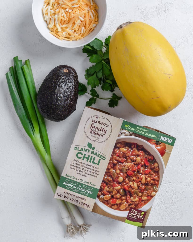 Golden Spaghetti Squash Bowls with Spicy Chili Cheese 3 Ingredients for Blount's Chili Stuffed Spaghetti Squash laid out against a white background.
