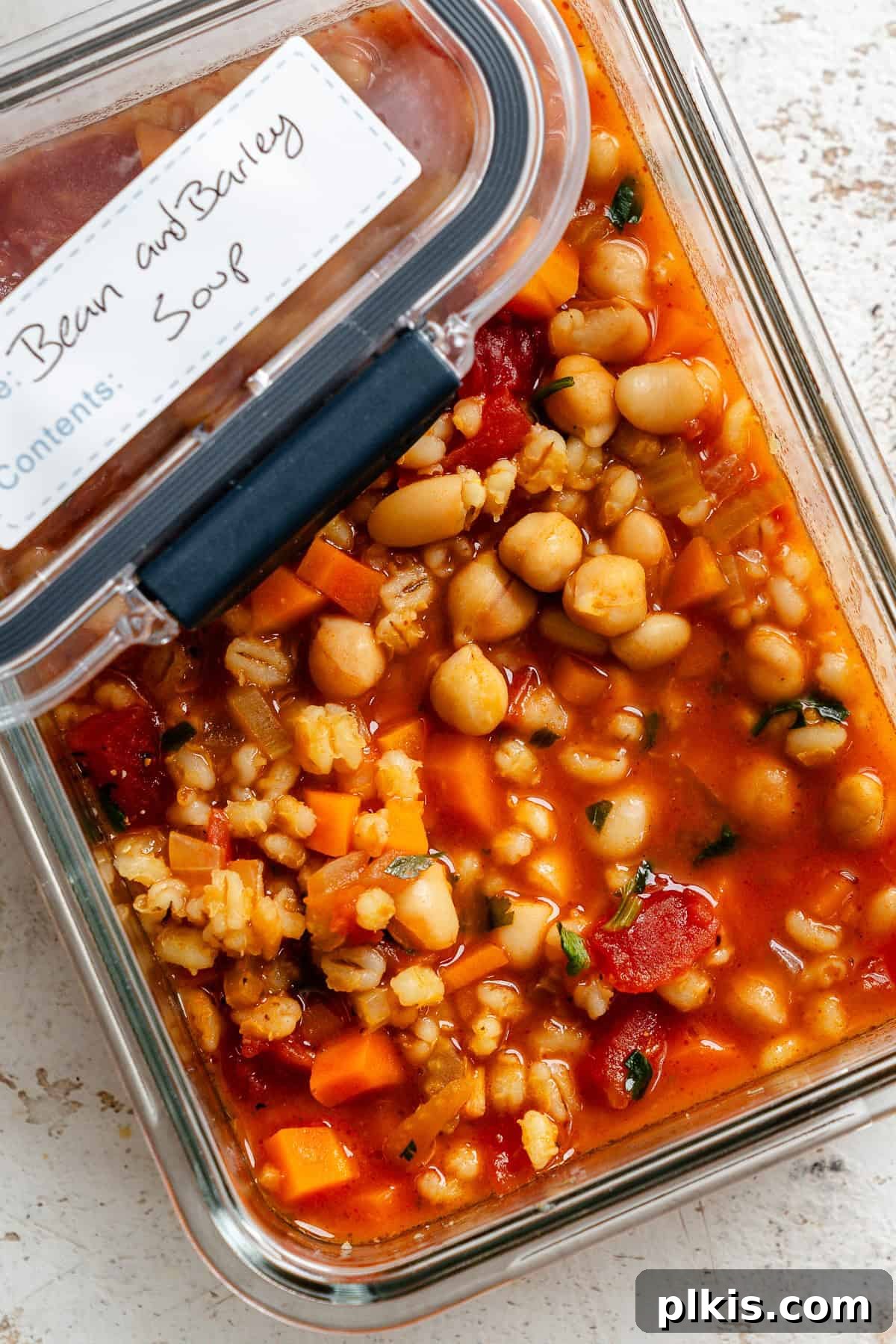 Hearty Barley and Bean Stew 9 Completed Barley and Bean Soup in a storage container.