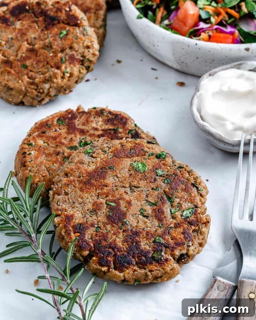 Quick & Delicious: 30-Minute Vegan Dinners 27 3 completed White Bean Burger patties against white surface.
