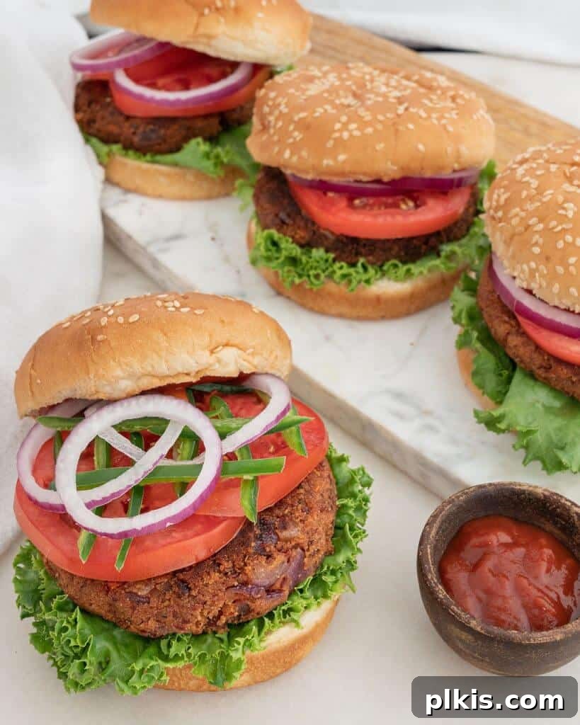 Quick & Delicious: 30-Minute Vegan Dinners 30 Several completed Spicy Red Bean Burgers on a white surface.