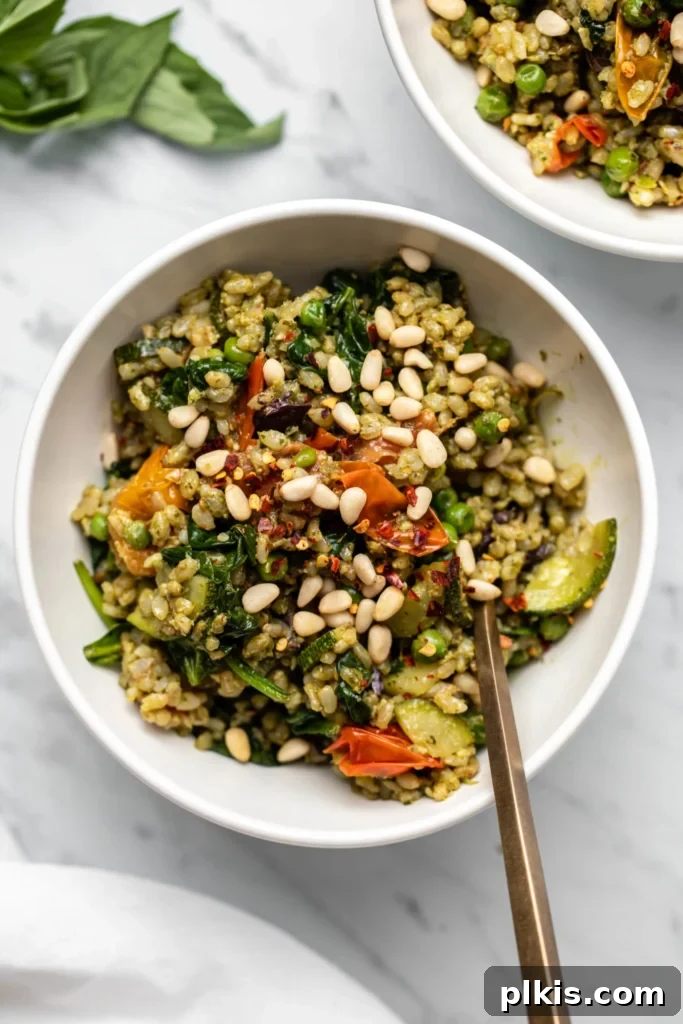 Quick & Delicious: 30-Minute Vegan Dinners 39 Completed Pesto Fried Rice with Veggies in a white plate against a white background.