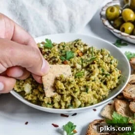 A bowl of vibrant Green Olive Tapenade, ready to be enjoyed.