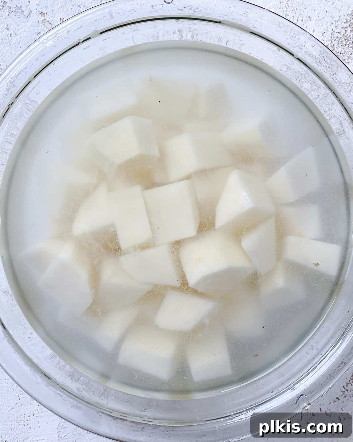 Healthy Patatas Bravas Roasted Sauteed Air Fried 4 procces shot showing potatoes in water in a bowl