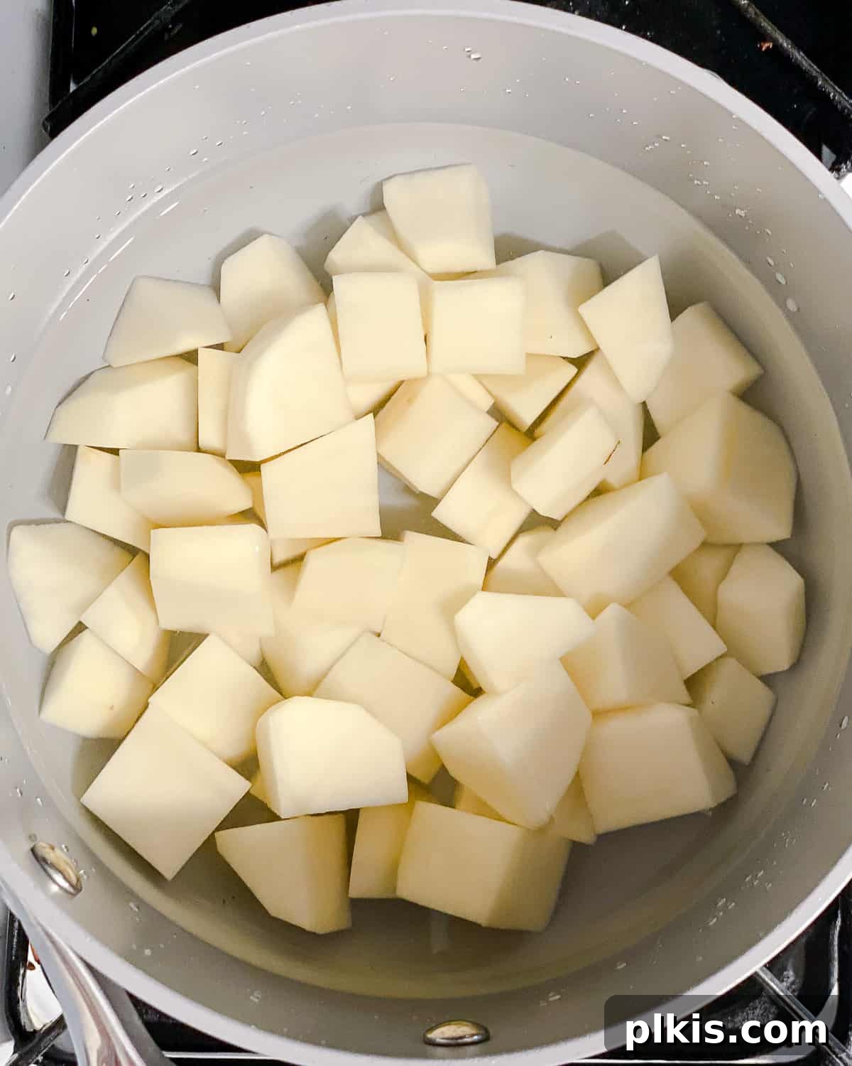 Healthy Patatas Bravas Roasted Sauteed Air Fried 5 procces shot showing potatoes in water in a pot