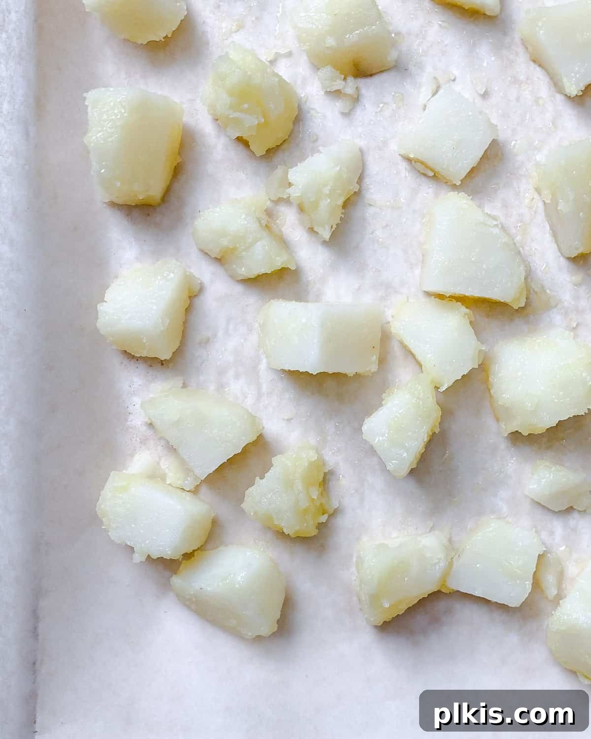 Healthy Patatas Bravas Roasted Sauteed Air Fried 8 process shot showing potatoes on baking sheet
