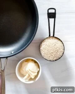 Ingredients for the panko topping, including vegan butter and breadcrumbs, laid out next to a black baking dish.