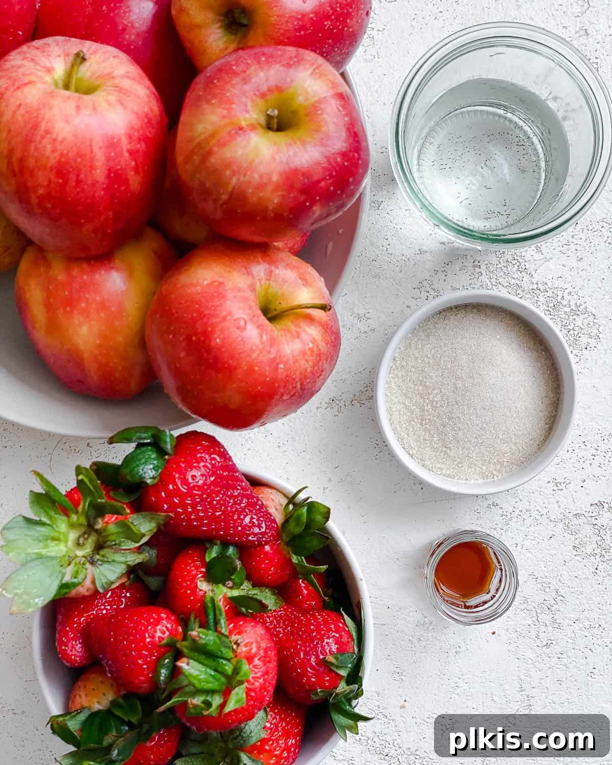 Blush Berry Apple Puree 3 ingredients for Easy Strawberry Apple Sauce measured out against a white surface