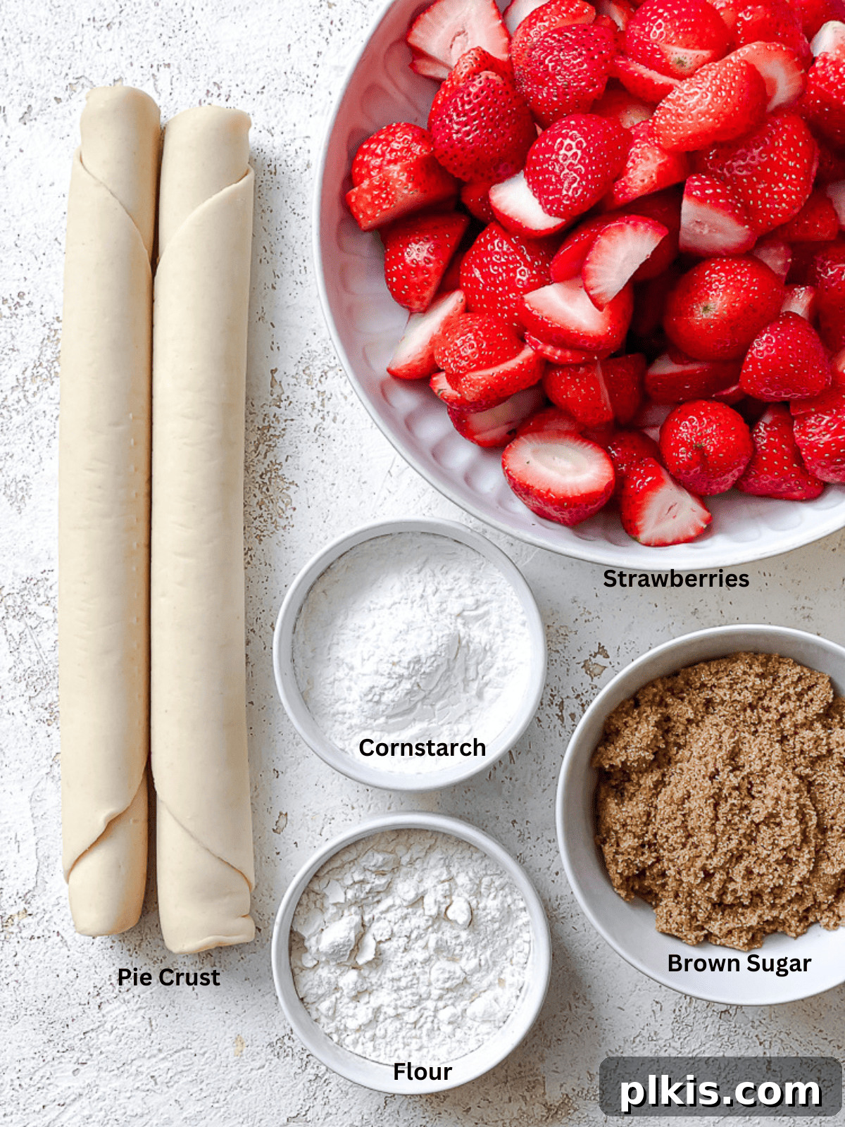 Luscious Vegan Strawberry Pie 3 Ingredients laid out for Easy Strawberry Pie on a white surface