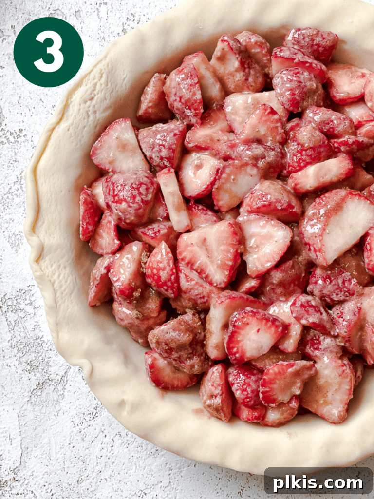 Luscious Vegan Strawberry Pie 6 Process shot of adding strawberry filling to pie crust