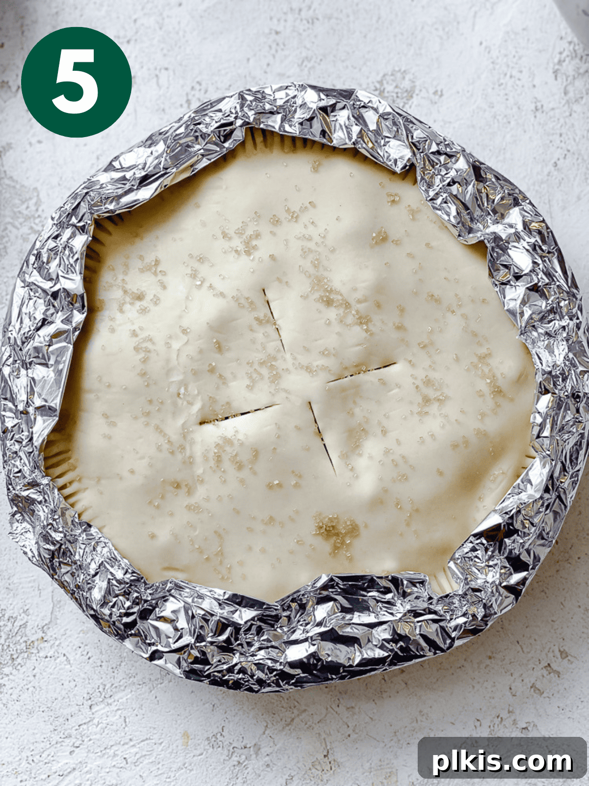 Luscious Vegan Strawberry Pie 8 Process shot showing aluminum foil around the crust edges of the pie before baking