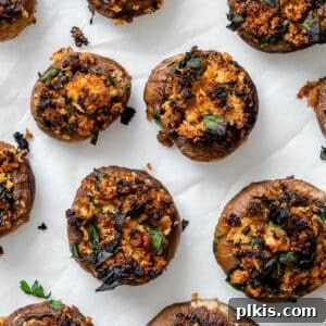completed Easy Vegan Stuffed Mushrooms on a white surface