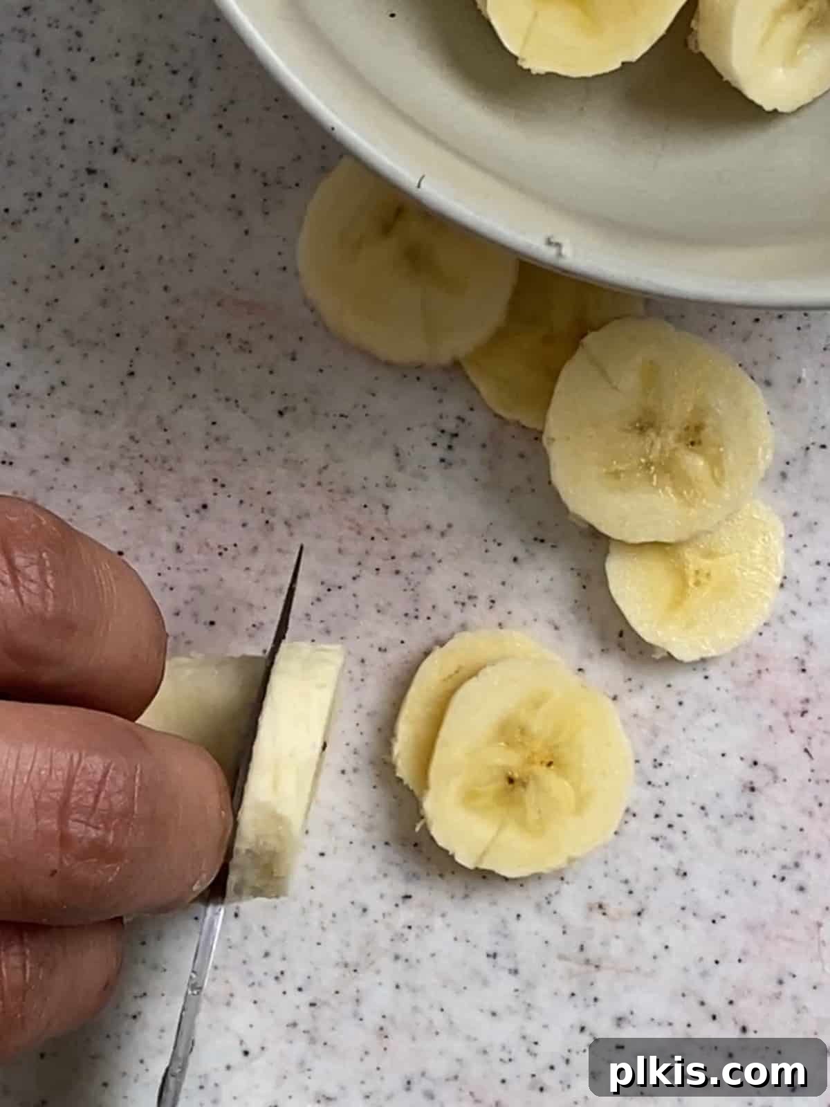 Sunshine Fruit Pizza 7 process of cutting bananas into slices