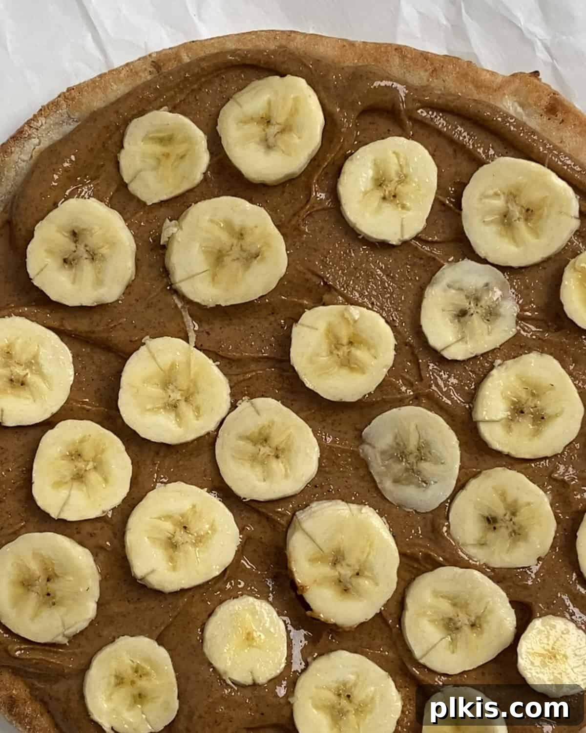 Sunshine Fruit Pizza 8 process of adding sliced bananas to fruit pizza