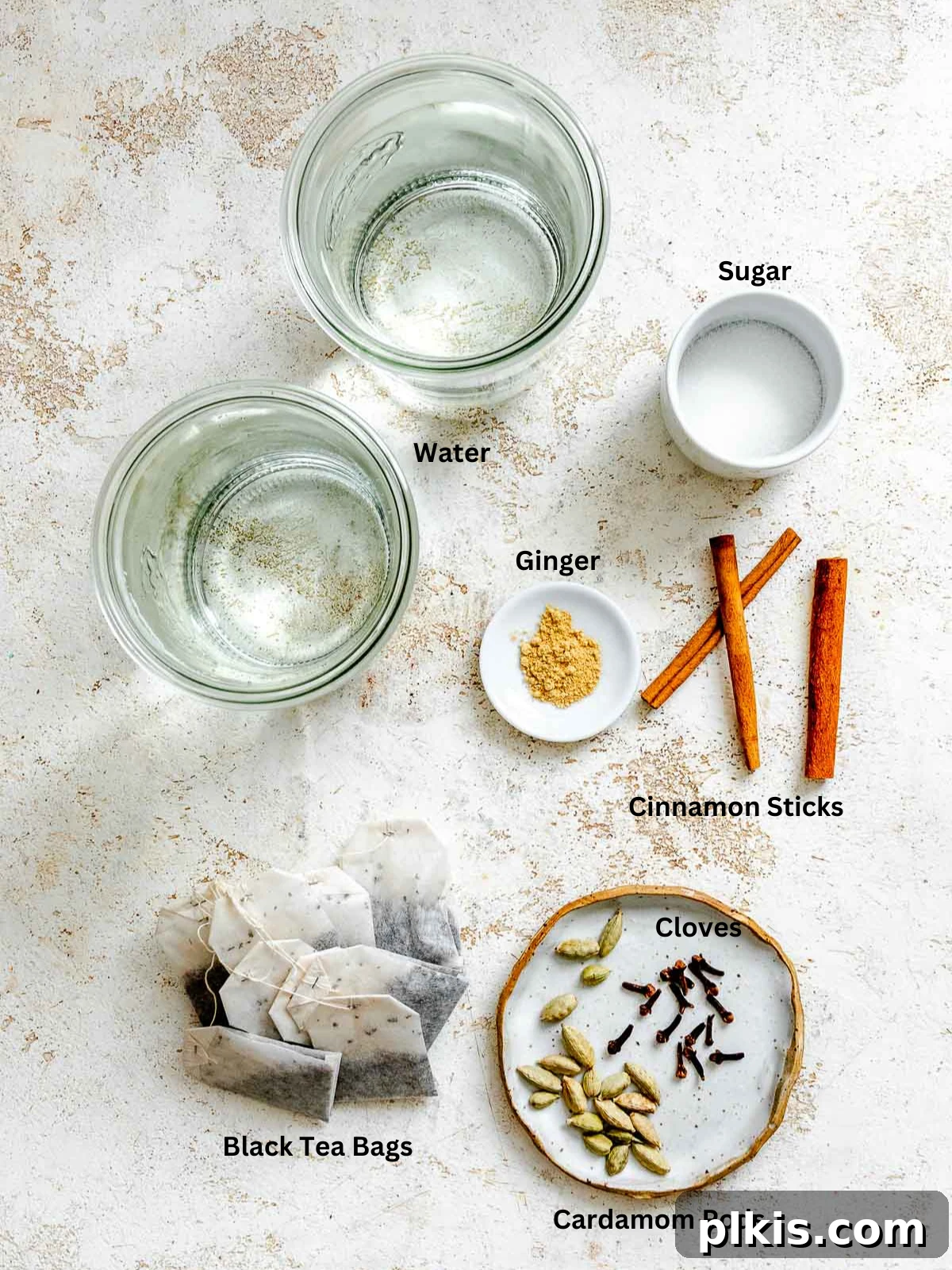 Spiced Chai Concentrate from Scratch 3 Ingredients for Homemade Chai Concentrate measured out on a white surface.