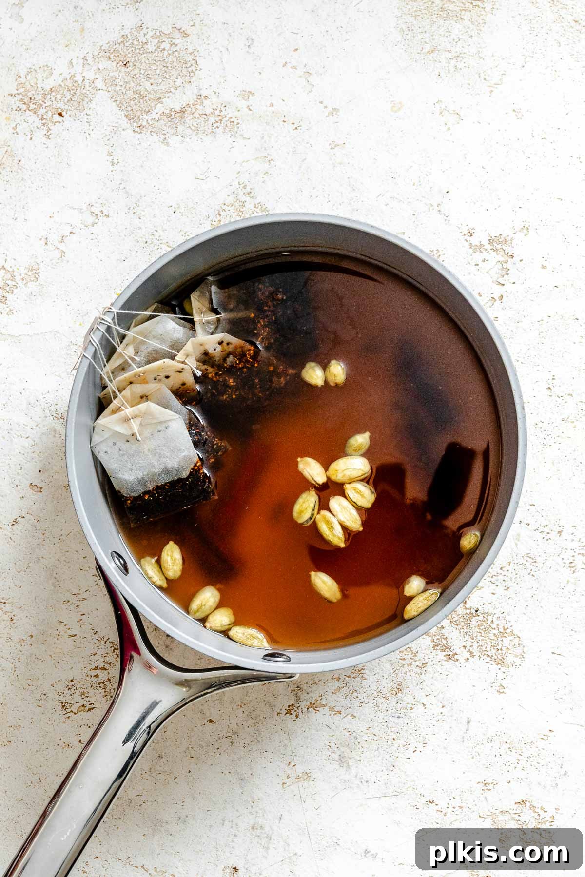 Spiced Chai Concentrate from Scratch 5 Process shot showing ingredients for Homemade Chai Concentrate in a pan.