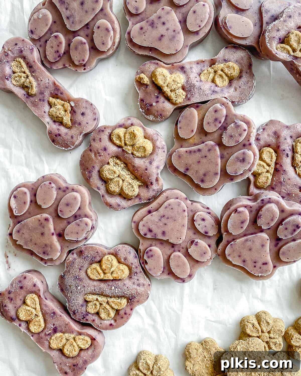 Frosty Peanut Butter Banana Puppy Snacks 2 Delicious Frozen Peanut Butter Banana Dog Treats laid out on a clean white surface, perfect for summer cooling