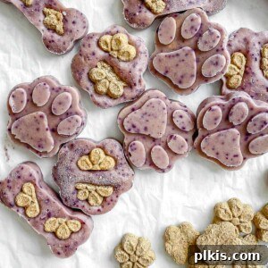 Completed Frozen Peanut Butter Banana Dog Treats spread out on a white surface