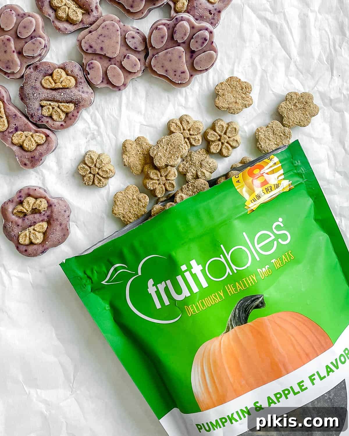 Frosty Peanut Butter Banana Puppy Snacks 3 Arrangement of completed Frozen Peanut Butter Banana Dog Treats alongside Fruitables packaging on a white background, highlighting their quality ingredients