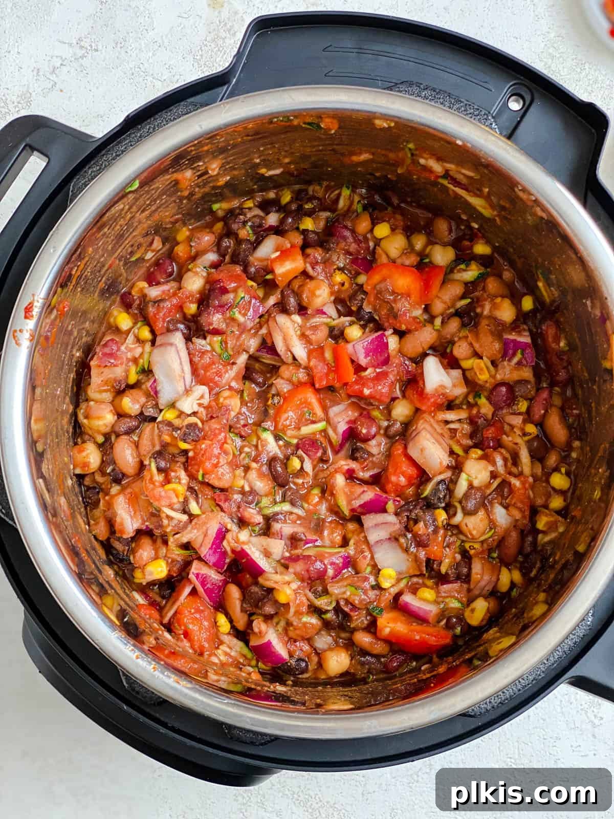 The Ultimate Vegan Bean Chili stovetop Slow Cooker Instant Pot 8 A series of close-up photos demonstrating the progression of mixing and stirring the ingredients for the vegan chili in the pot.
