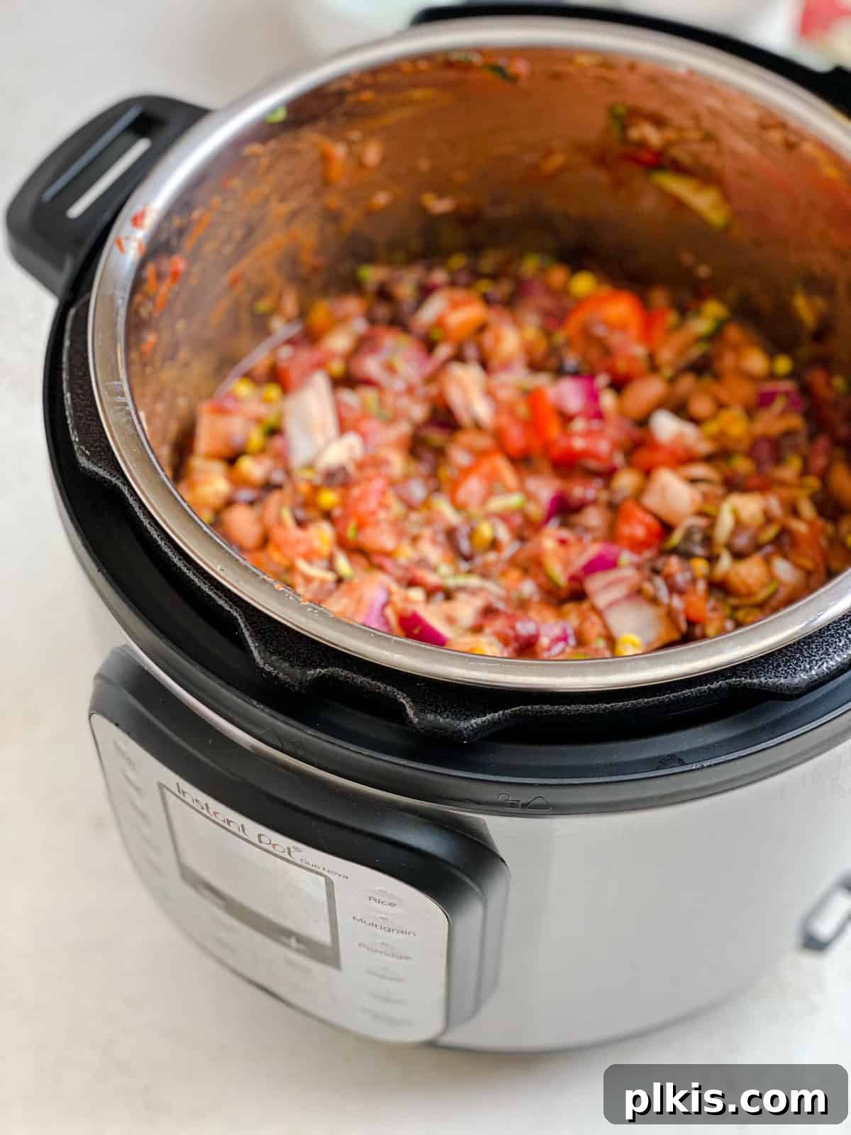 The Ultimate Vegan Bean Chili stovetop Slow Cooker Instant Pot 9 Final process shot before cooking, showing all vegan chili ingredients thoroughly mixed and ready in the slow cooker pot.