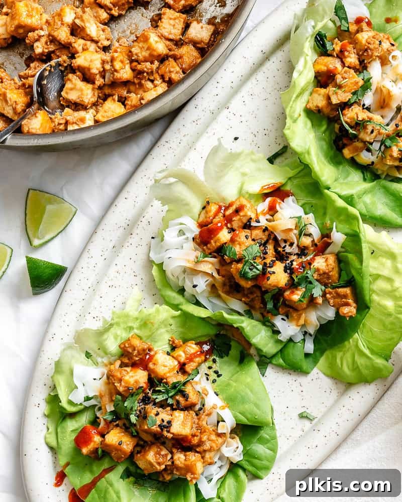 Completed Tofu Lettuce Wraps with Peanut Sauce on a platter, ready to be served.