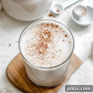 completed Easy Vegan Eggnog on a brown and white surface