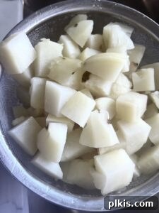 Zesty Artichoke and Potato Salad 5 Cut up potatoes in a large bowl after boiling, ready for dressing.